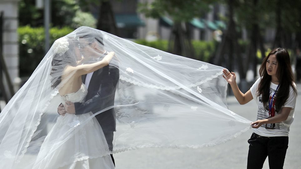 kina_gamos_AP_Photo_Eugene_Hoshiko